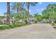 Gated community entrance framed by mature trees, lush landscaping, and well-maintained entryway at 1342 Benevolent St, Maitland, FL 32751
