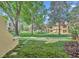 Lush community green space providing beautiful landscaping, mature shade trees, and sidewalks at 1342 Benevolent St, Maitland, FL 32751