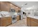 Modern kitchen features stainless steel appliances, tile flooring, and plenty of cabinet space at 1342 Benevolent St, Maitland, FL 32751