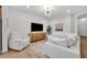 Comfortable living room featuring white furniture and entertainment center at 1342 Benevolent St, Maitland, FL 32751