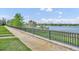 Scenic water view of the lake framed by lush greenery and a walking path, offering tranquility at 1342 Benevolent St, Maitland, FL 32751