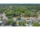 Aerial view of the property showing mature trees and nearby roadway access at 1365 Lake Dr, Casselberry, FL 32707