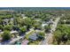 Aerial view of a home in a serene neighborhood with lush greenery at 1365 Lake Dr, Casselberry, FL 32707