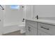 Modern bathroom showcasing a sleek vanity, toilet, and bathtub with stylish fixtures and finishes at 1365 Lake Dr, Casselberry, FL 32707