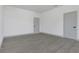Spacious bedroom featuring wood-look flooring, neutral walls, and two closets for ample storage at 1365 Lake Dr, Casselberry, FL 32707