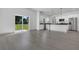 An open space featuring wood-look floors, white walls, and sliding doors to the yard at 1365 Lake Dr, Casselberry, FL 32707