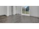 Sunlit living room with sliding glass doors leading to an outdoor space at 1365 Lake Dr, Casselberry, FL 32707