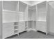 Spacious walk-in closet with custom shelving and drawers offering ample storage solutions at 1365 Lake Dr, Casselberry, FL 32707