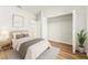 Bedroom with a view of the walk-in closet and wood-look flooring at 14953 Sw 38Th Cir, Ocala, FL 34473