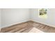 The bedroom has warm wood floors and a bright window view at 14953 Sw 38Th Cir, Ocala, FL 34473