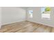 Bedroom featuring neutral walls and floors and two bright windows at 14953 Sw 38Th Cir, Ocala, FL 34473
