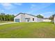 Lovely exterior view of a single-Gathering home with well-kept lawn on a sunny day at 14953 Sw 38Th Cir, Ocala, FL 34473