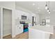 Bright kitchen with white cabinetry, stainless steel appliances, pantry, and a stylish island at 14953 Sw 38Th Cir, Ocala, FL 34473