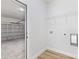 This laundry area offers a shelving unit, washer hookups, and garage access at 14953 Sw 38Th Cir, Ocala, FL 34473