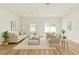 Bright living room featuring a neutral palette, recessed lighting, and sliding glass doors at 14953 Sw 38Th Cir, Ocala, FL 34473