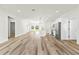 Open concept living room and kitchen with modern finishes and lots of natural light at 14953 Sw 38Th Cir, Ocala, FL 34473