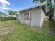 A single-story home with a gray stucco exterior and a backyard at 1515 20Th St, Orlando, FL 32805