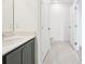 Bathroom area with a white vanity and access to the toilet and other rooms at 15489 Hamlin Park Drive, Winter Garden, FL 34787