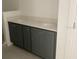 New bathroom featuring double vanity with gray cabinets, white countertops, and fixtures at 15489 Hamlin Park Drive, Winter Garden, FL 34787