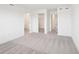 Spacious bedroom showcasing neutral carpet, white walls, and multiple doorways at 15489 Hamlin Park Drive, Winter Garden, FL 34787
