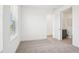 Cozy bedroom with carpet, a view, and an ensuite bathroom entrance at 15489 Hamlin Park Drive, Winter Garden, FL 34787