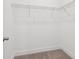Empty carpeted closet with a wire shelf inside at 15489 Hamlin Park Drive, Winter Garden, FL 34787