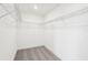 Walk-in closet showing wire shelving and neutral carpeting at 15489 Hamlin Park Drive, Winter Garden, FL 34787