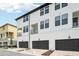 Three-story townhomes feature private garages, balconies, and modern design at 15489 Hamlin Park Drive, Winter Garden, FL 34787