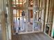 Interior of a room under construction with wooden framing, plumbing and electrical wiring at 15489 Hamlin Park Drive, Winter Garden, FL 34787