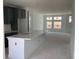 Open-concept kitchen showcasing a large central island, contemporary cabinets, and bright natural lighting at 15489 Hamlin Park Drive, Winter Garden, FL 34787