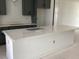 Expansive kitchen island with a crisp white finish and a sleek countertop, ready for culinary adventures at 15489 Hamlin Park Drive, Winter Garden, FL 34787