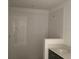 New bathroom showcasing tiled shower area with modern fixtures and a vanity at 15489 Hamlin Park Drive, Winter Garden, FL 34787