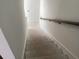 New home staircase with wooden handrail and contemporary design at 15489 Hamlin Park Drive, Winter Garden, FL 34787