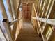 View looking down stairway under construction in a new home with wood framing at 15489 Hamlin Park Drive, Winter Garden, FL 34787