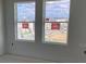 New home construction highlighting windows that look out to the surrounding neighborhood at 15489 Hamlin Park Drive, Winter Garden, FL 34787