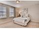 Bedroom showcases a comfortable bed with soft bedding, window, and decorative wall art at 1550 Dalehurst Ln, Kissimmee, FL 34744