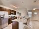 Modern kitchen with granite countertops, stainless steel appliances, bar seating, and open layout perfect for entertaining at 1550 Dalehurst Ln, Kissimmee, FL 34744