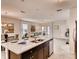 Modern kitchen features a center island with granite countertops and stainless steel appliances at 1550 Dalehurst Ln, Kissimmee, FL 34744