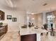Well-equipped kitchen featuring granite countertops, breakfast bar, and stainless steel appliances, seamlessly blending with dining area at 1550 Dalehurst Ln, Kissimmee, FL 34744