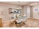 Bright dining area featuring modern table set and elegant chandelier lighting fixture at 1554 Dalehurst Ln, Kissimmee, FL 34744