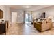 Inviting living room with modern decor, neutral colors, and sliding door to a patio at 1554 Dalehurst Ln, Kissimmee, FL 34744