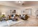 Cozy living area showcasing tile flooring, comfortable seating, and stylish decor at 1554 Dalehurst Ln, Kissimmee, FL 34744