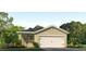 Charming single-Gathering home with a one-car garage and well-manicured landscaping at 1858 Waggoner St, Kissimmee, FL 34744