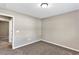 Neutral bedroom with cozy carpet, and an open doorway at 1883 Sw 160Th Pl, Ocala, FL 34473