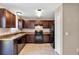 Charming kitchen featuring modern appliances, ample counter space, tile floors and convenient access to the pantry at 1883 Sw 160Th Pl, Ocala, FL 34473