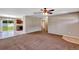 Open-concept living area with modern finishes, neutral colors, and access to the kitchen and outdoor space at 1883 Sw 160Th Pl, Ocala, FL 34473