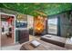 Indiana Jones-themed bedroom with jungle decor, TV, and themed artwork for an immersive experience at 1970 Summer Dr, Davenport, FL 33897