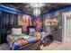 The Star Wars-themed bedroom features themed decor, two beds, and a striking light fixture at 1970 Summer Dr, Davenport, FL 33897