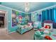 The Little Mermaid-themed bedroom boasts vibrant colors, custom murals, and whimsical decor for an enchanting stay at 1970 Summer Dr, Davenport, FL 33897