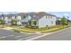 Charming two-story home features a well-maintained lawn, landscaped yard, and attached two-car garage at 1970 Summer Dr, Davenport, FL 33897